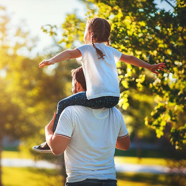 Happy father and daughter in the garden